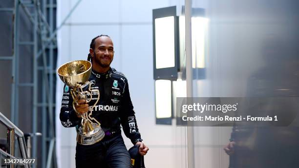 Race winner Lewis Hamilton of Great Britain and Mercedes GP celebrates on the podium during the F1 Grand Prix of Russia at Sochi Autodrom on...