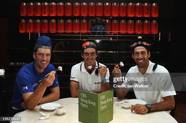 Ross Fisher of England, Edoardo Molinari of Italy and Alvaro Quiros of Spain pose for photos at Hullet House during previews ahead of the USB Hong...