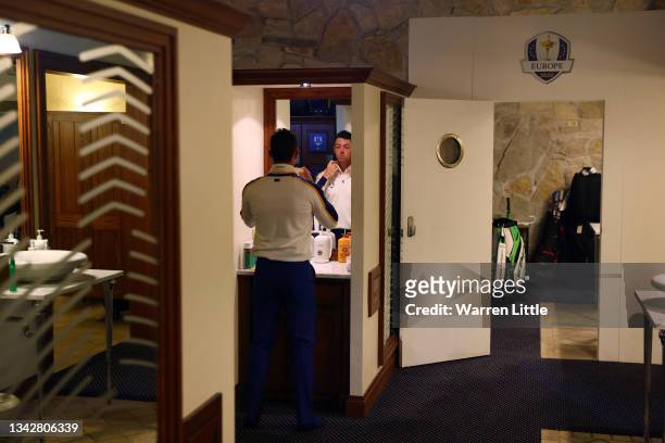 Rory McIlroy of Northern Ireland and team Europe prepares in the locker room prior to his singles match against Xander Schauffele of team United...