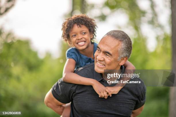 granddaughter and grandfather outdoor portrait - granddaughter stock pictures, royalty-free photos & images