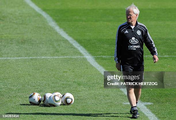 Danish coach Morten Olsen watches his players as they take part in a training session in Randburg, on June 3, 2010 prior to the start of the FIFA...