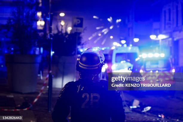 Fireworks explode as policemen stand by during protests in Roubaix, northern France on June 30 three days after a teenager was shot dead during a...