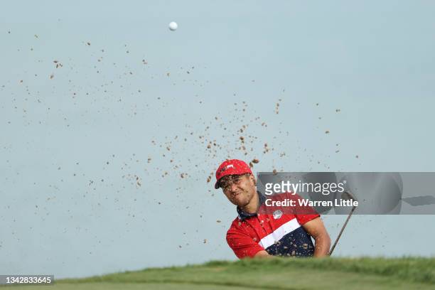 Xander Schauffele of team United States plays a shot from a bunker on the fourth hole during Sunday Singles Matches of the 43rd Ryder Cup at...