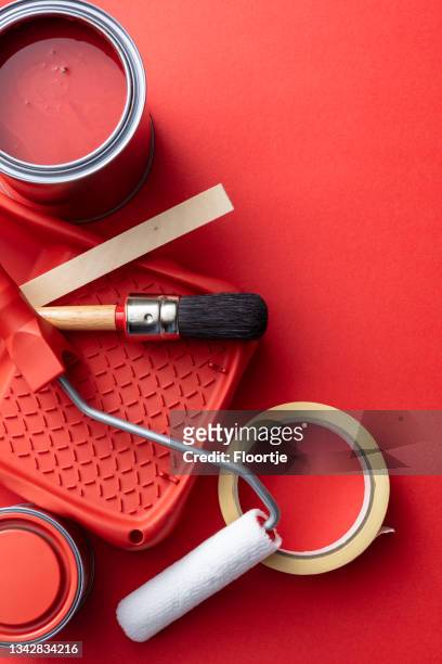 paint: paint equipment on red background - paint tray stock pictures, royalty-free photos & images