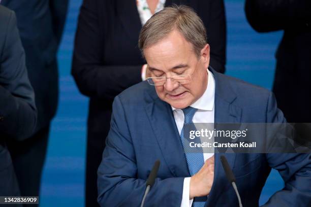 Armin Laschet, chancellor candidate of the Christian Democrats , gives his speech in reaction to initial results at CDU headquarters in federal...