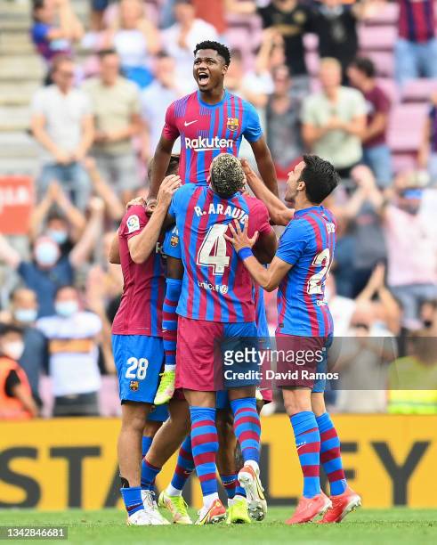 Ansu Fati of FC Barcelona celebrates with his team mates after scoring his team's third goal during the LaLiga Santander match between FC Barcelona...