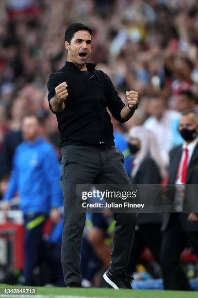 Mikel Arteta, Manager of Arsenal celebrates their side's victory after the Premier League match between Arsenal and Tottenham Hotspur at Emirates...