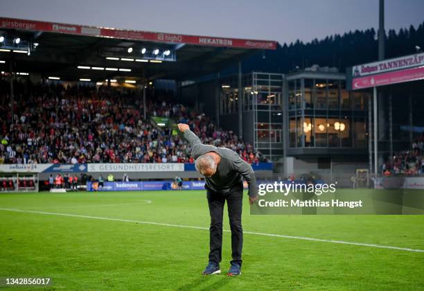 Head coach Christian Streich of Freiburg bows infront of the fans after the Bundesliga match between Sport-Club Freiburg and FC Augsburg at...