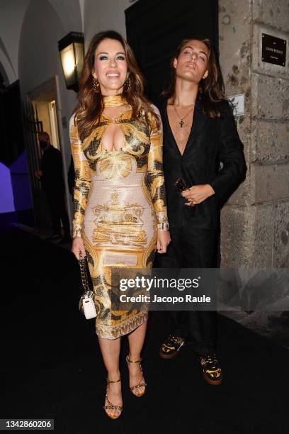 Elizabeth Hurley and Damian Charles Hurley are seen ahead of the Versace special event during the Milan Fashion Week Spring / Summer 2022 on...