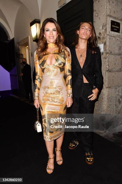 Elizabeth Hurley and Damian Charles Hurley are seen ahead of the Versace special event during the Milan Fashion Week Spring / Summer 2022 on...