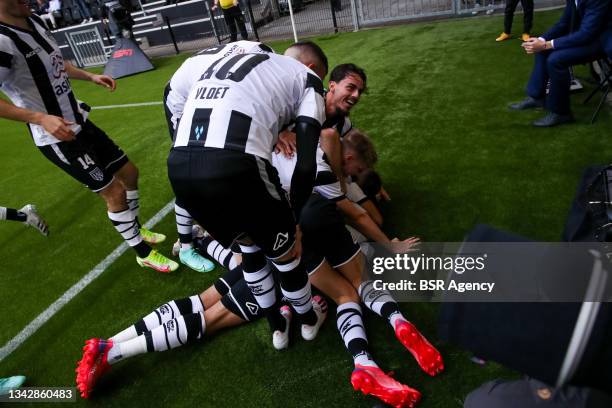 Delano Burgzorg of Heracles Almelo celebrates after scoring his side's first goal with his team mates during the Dutch Eredivisie match between...