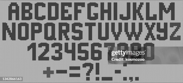 alphabet knitted on a white background with black yarn - white canvas background stock illustrations
