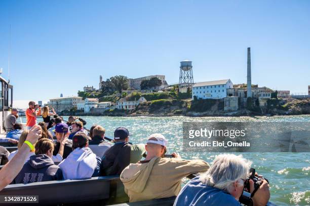 tourists arriving at alcatraz island - alcatraz stock pictures, royalty-free photos & images