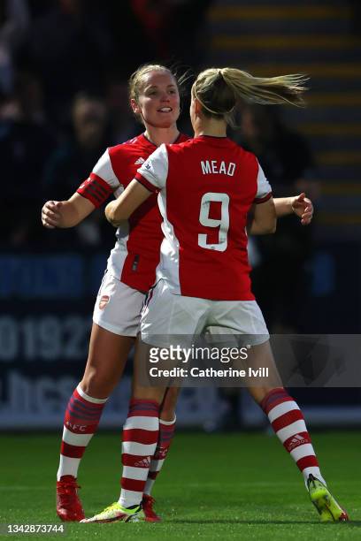 Kim Little of Arsenal celebrates with team mate Beth Mead after scoring her team's second goal of the game during the Barclays FA Women's Super...