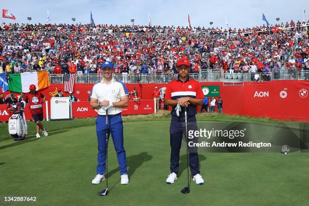 Rory McIlroy of Northern Ireland and team Europe and Xander Schauffele of team United States pose on the first tee during Sunday Singles Matches of...