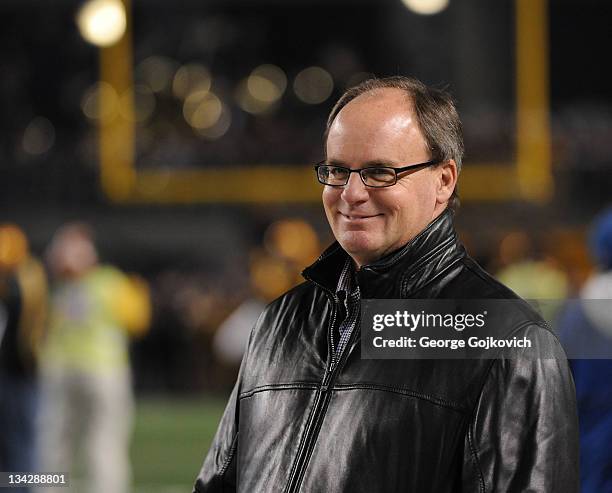 General Manager Kevin Colbert of the Pittsburgh Steelers smiles as he looks on from the sideline before a game against the Baltimore Ravens at Heinz...