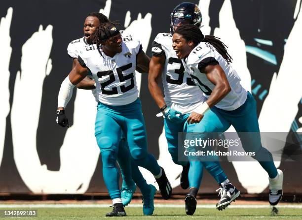 Jamal Agnew of the Jacksonville Jaguars celebrates with teammates after returning a missed FG for a touchdown during the first half in the game...