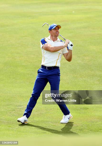 Rory McIlroy of Northern Ireland and team Europe plays his second shot on the 11th hole during Sunday Singles Matches of the 43rd Ryder Cup at...