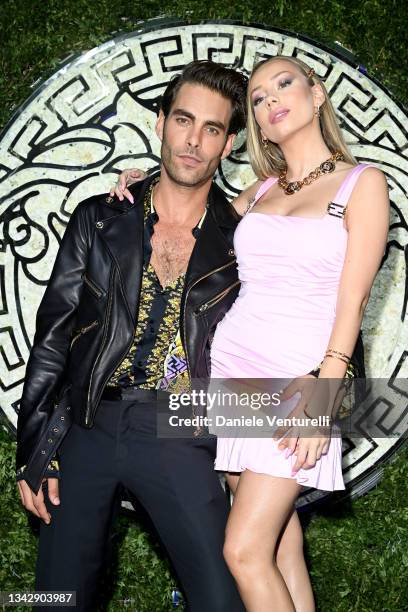 Ester Expósito and Jon Kortajarena are seen on the front row of the Versace special event during the Milan Fashion Week - Spring / Summer 2022 on...