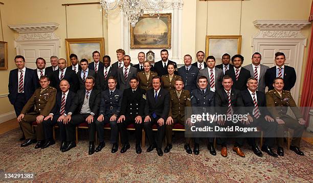 The Northern Hemisphere team pose for a team photograph with the Prime Minster David Cameron during a reception for the Help For Heroes Challenge...