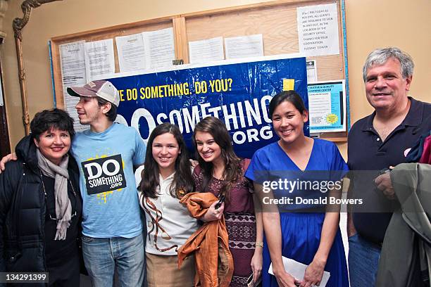 Diane Donchak, Justin Long, Alexandra Capellini, Alex Rush, Naomi Hirabayashi and Richard Capellini pose in front on the DoSomething banner during...