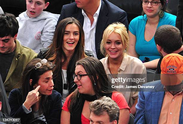 Ali Lohan and Lindsay Lohan attend the Memphis Grizzlies vs New York Knicks game at Madison Square Garden on March 17, 2011 in New York City.