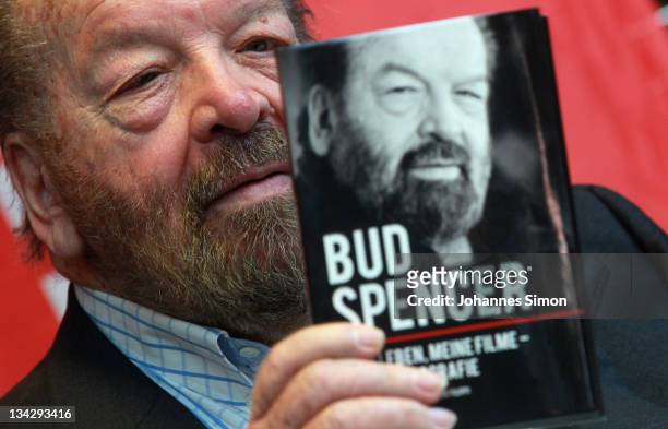 Italian actor Bud Spencer poses with a copy of his autobiography at Hugendubel bookstore on November 30, 2011 in Munich, Germany.