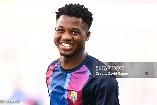 Ansu Fati of FC Barcelona smiles during the warm up prior to the LaLiga Santander match between FC Barcelona and Levante UD at Camp Nou on September...