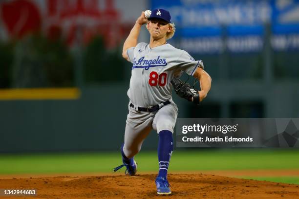 Starting pitcher Emmet Sheehan of the Los Angeles Dodgers delivers to home plate in the first inning against the Colorado Rockies at Coors Field on...