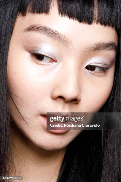 Model poses in the backstage of the Hui fashion show during the Milan Fashion Week - Spring / Summer 2022 on September 26, 2021 in Milan, Italy.