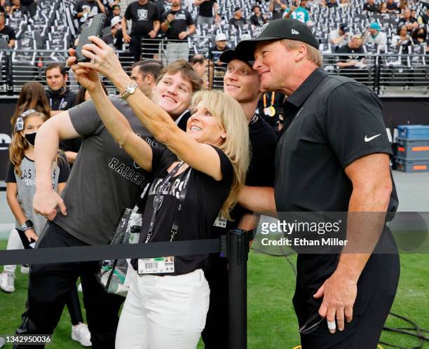 Jayson Gruden, Cindy Gruden, Michael Gruden and head coach Jon Gruden of the Las Vegas Raiders pose for a photo before the Raiders' game against the...