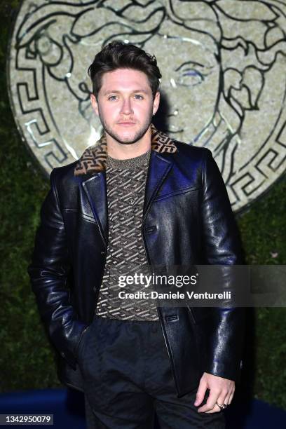 Niall Horan is seen on the front row of the Versace special event during the Milan Fashion Week - Spring / Summer 2022 on September 26, 2021 in...