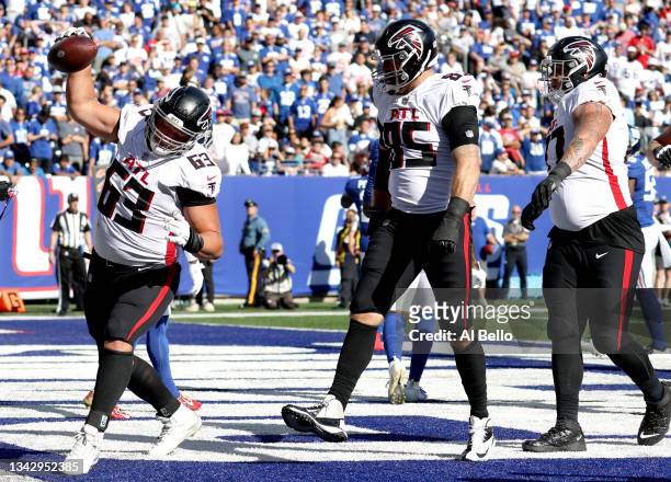 Chris Lindstrom of the Atlanta Falcons spikes the ball after a touchdown by Lee Smith of the Atlanta Falcons during the fourth quarter in the game...
