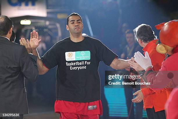 Players with Special Olympics t-shirts during the presentation before the 2011-2012 Turkish Airlines Euroleague Regular Season Game Day 7 between...