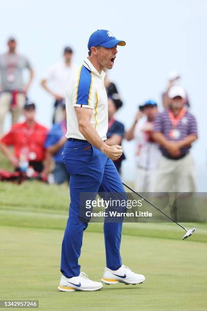 Rory McIlroy of Northern Ireland and team Europe celebrates on the 14th green during Sunday Singles Matches of the 43rd Ryder Cup at Whistling...