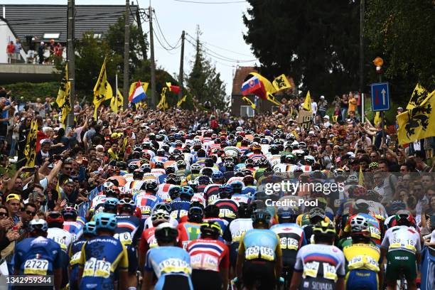General view of the Peloton passing through Moskesstraat hill while fans cheer during the 94th UCI Road World Championships 2021 - Men Elite Road...