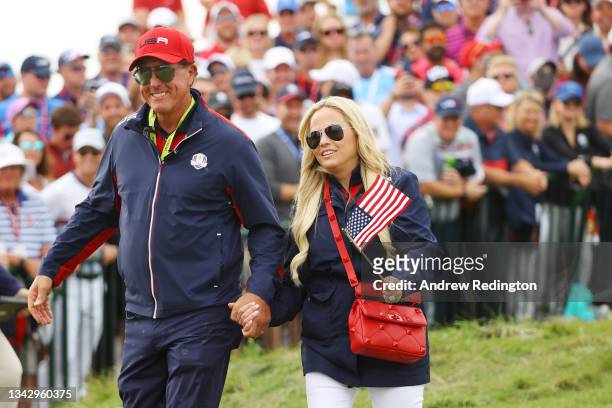 Vice-captain Phil Mickelson of team United States and wife Amy Mickelson walk on the 15th hole during Sunday Singles Matches of the 43rd Ryder Cup at...