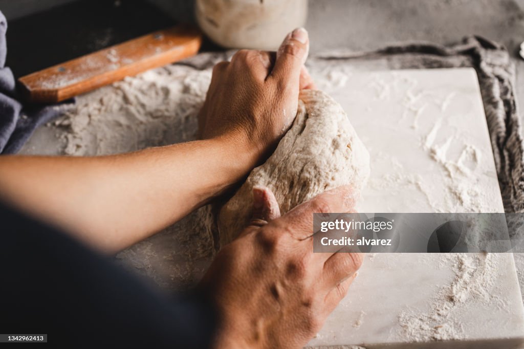 Woman kneading bread dough