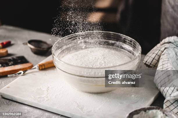 flour in a mixing bowl for making sourdough bread in kitchen - mixing bowl stock pictures, royalty-free photos & images