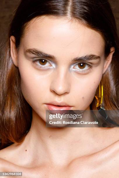 Model poses in the backstage of the Hui fashion show during the Milan Fashion Week - Spring / Summer 2022 on September 26, 2021 in Milan, Italy.