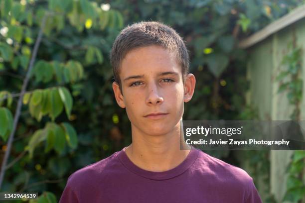 portrait of teenage boy at back yard - spain teen face bildbanksfoton och bilder