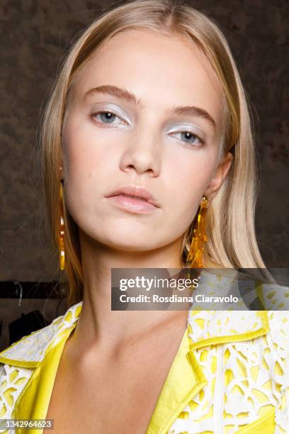 Model poses in the backstage of the Hui fashion show during the Milan Fashion Week - Spring / Summer 2022 on September 26, 2021 in Milan, Italy.