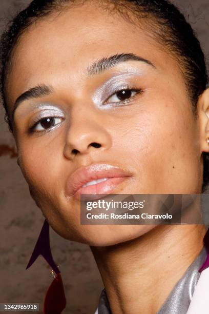 Model, make up detail, poses in the backstage of the Hui fashion show during the Milan Fashion Week - Spring / Summer 2022 on September 26, 2021 in...