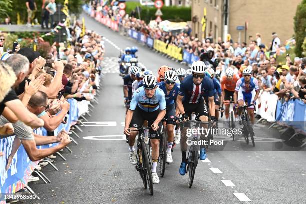 Remco Evenepoel of Belgium and Neilson Powless of The United States compete in the Breakaway while fans cheer during the 94th UCI Road World...