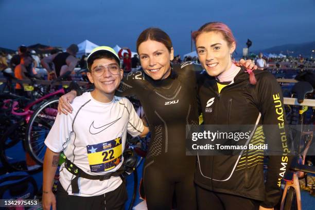 Ryan Cassata, Teresa Wlasiuk and Lucy Charles-Barclay compete in the celebrity race at the 34th Annual Malibu Triathlon at Zuma Beach on September...