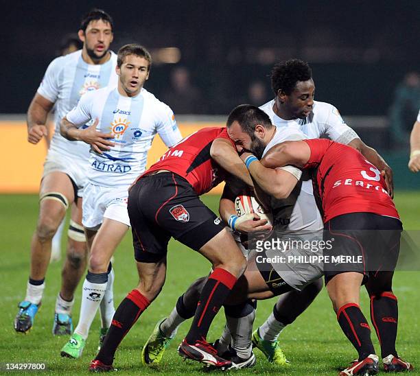 Montpellier's South African hooker Rassie Van Vuuren vies with Lyon's French prop Anthony Roux during the French Top 14 rugby union match Lyon vs....