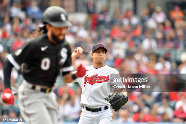 Relief pitcher Justin Garza of the Cleveland Indians throws out Billy Hamilton of the Chicago White Sox at first during the sixth inning at...