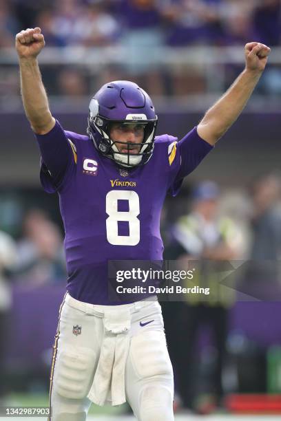 Kirk Cousins of the Minnesota Vikings celebrates after throwing a touchdown to Justin Jefferson during the second quarter in the game against the...