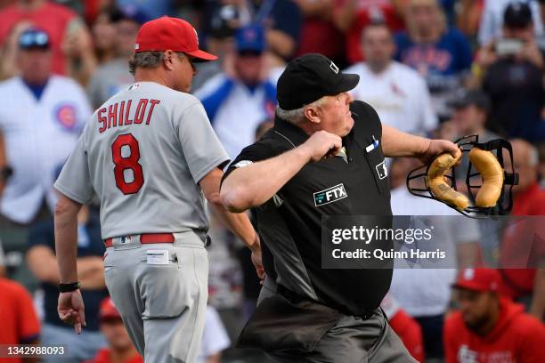 Manager Mike Shildt of the St. Louis Cardinals is ejected from the game in the ninth inning by umpire Bill Miller against the Chicago Cubs at Wrigley...