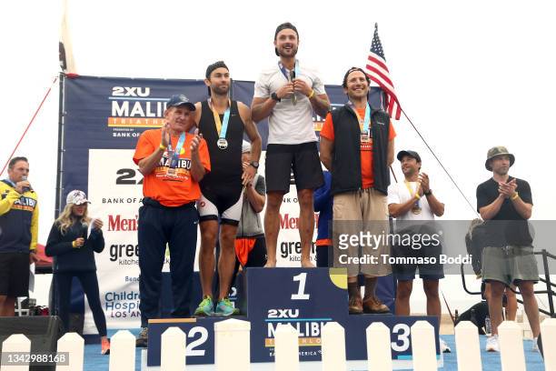 Andy Lauer, Chace Crawford, Dylan Efron and Mark Feuerstein on the podium at the celebrity race at the 34th Annual Malibu Triathlon at Zuma Beach on...